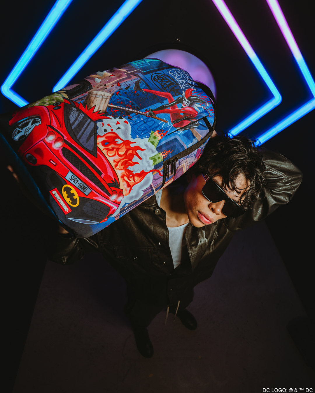Sprayground Harley Quinn backpack worn by a model in urban setting