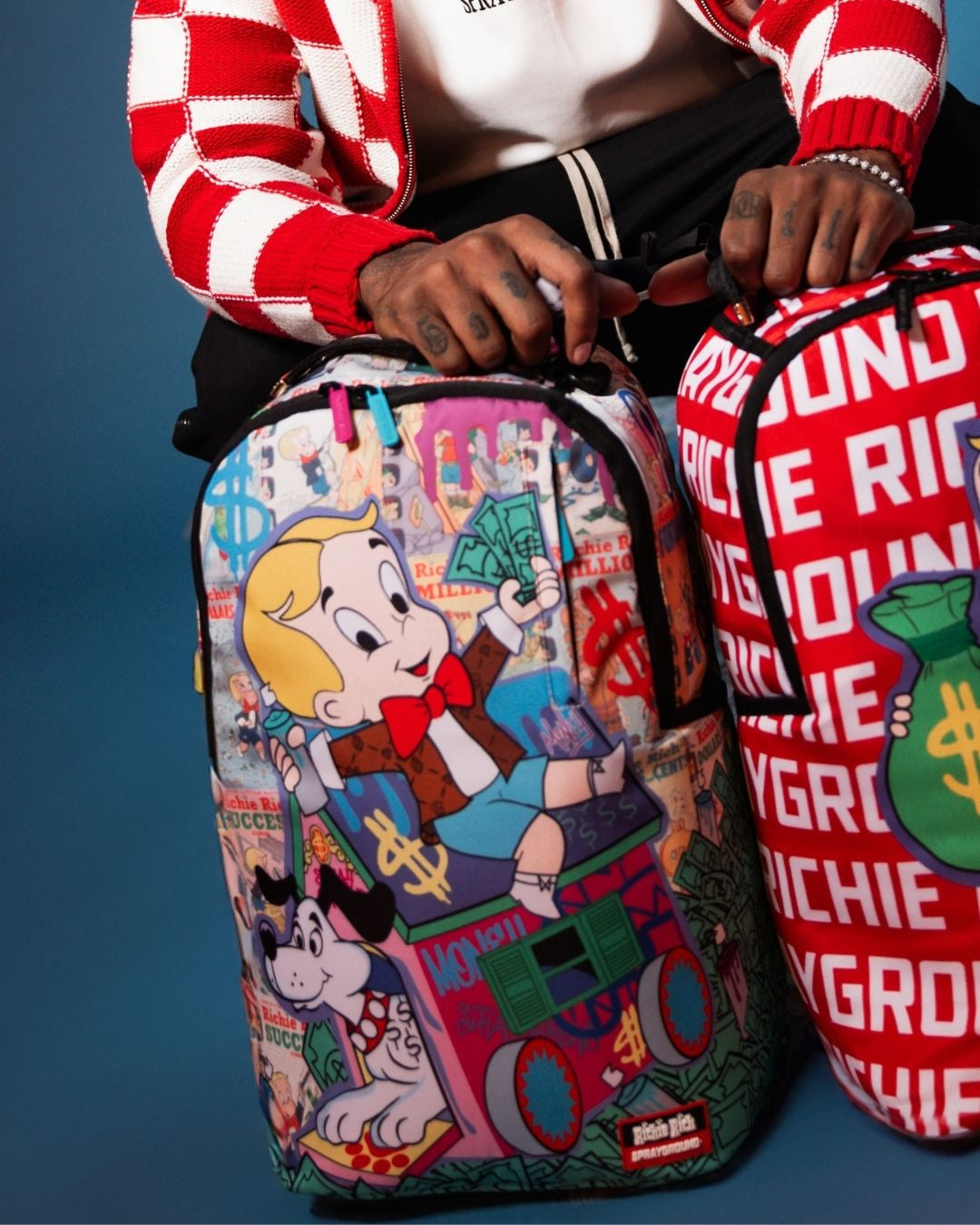 Richie Rich Deluxe Sprayground Backpack showcasing front zipper pocket and side pockets.