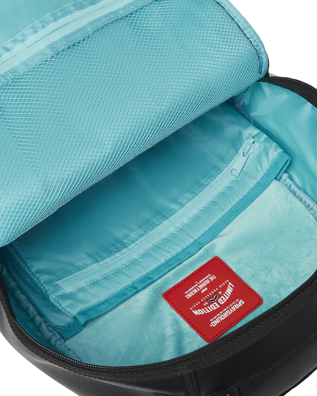 Front view of Sprayground faux leather tote bag showcasing compass panel and zippered pockets