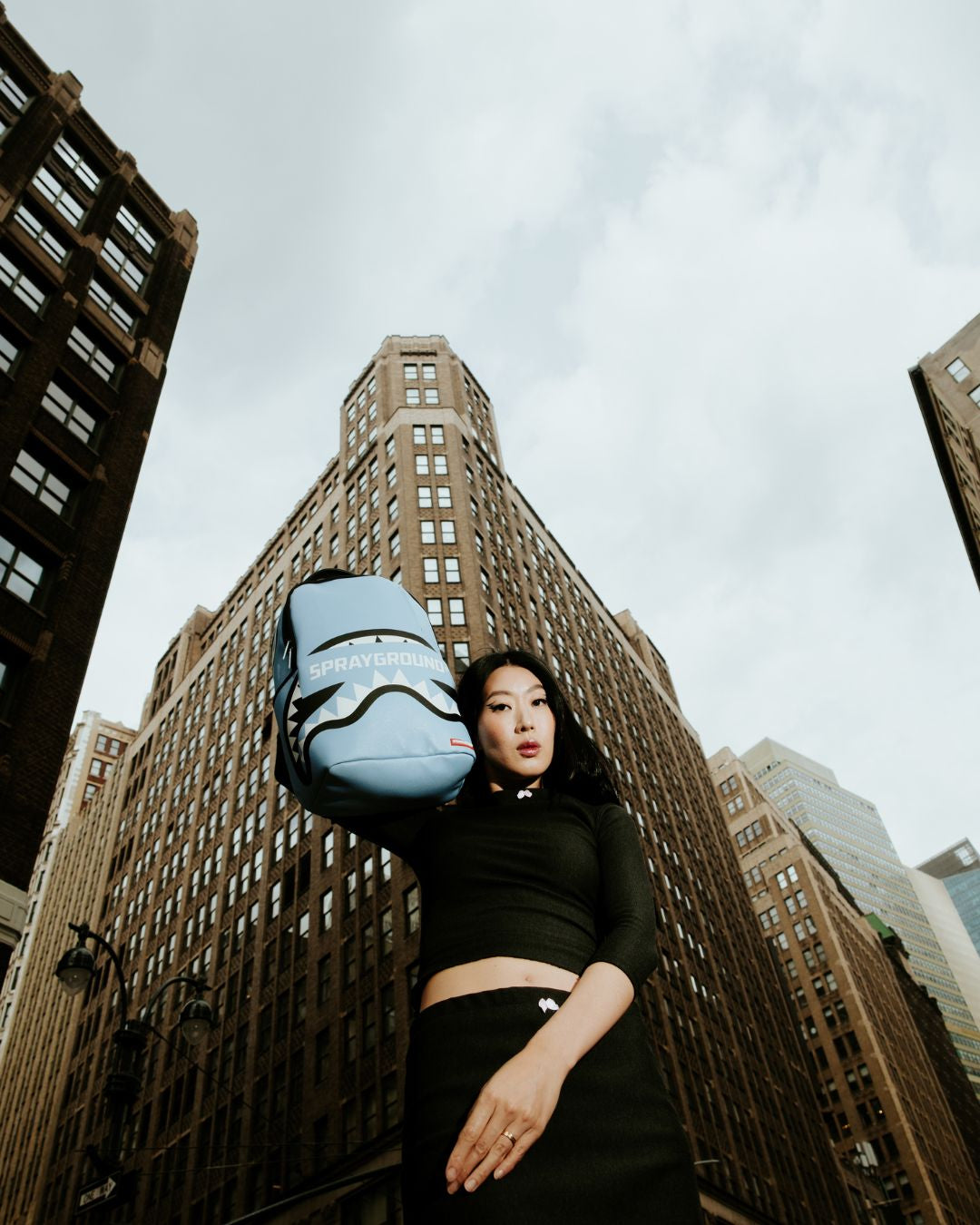 Side view of the backpack with side pockets and adjustable straps