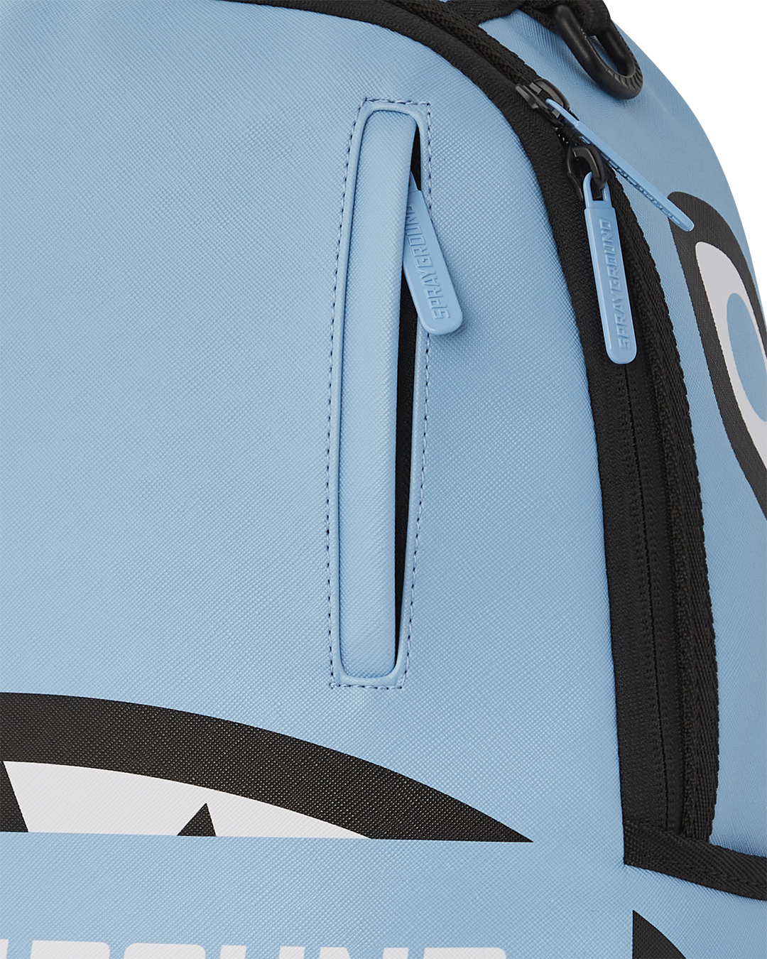 Sprayground faux leather backpack open, showcasing interior compartments