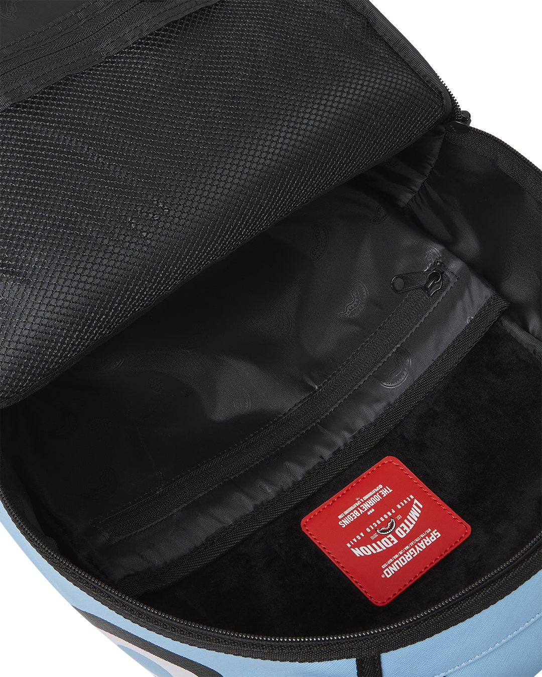 Backpack attached to rolling luggage via slide-through sleeve