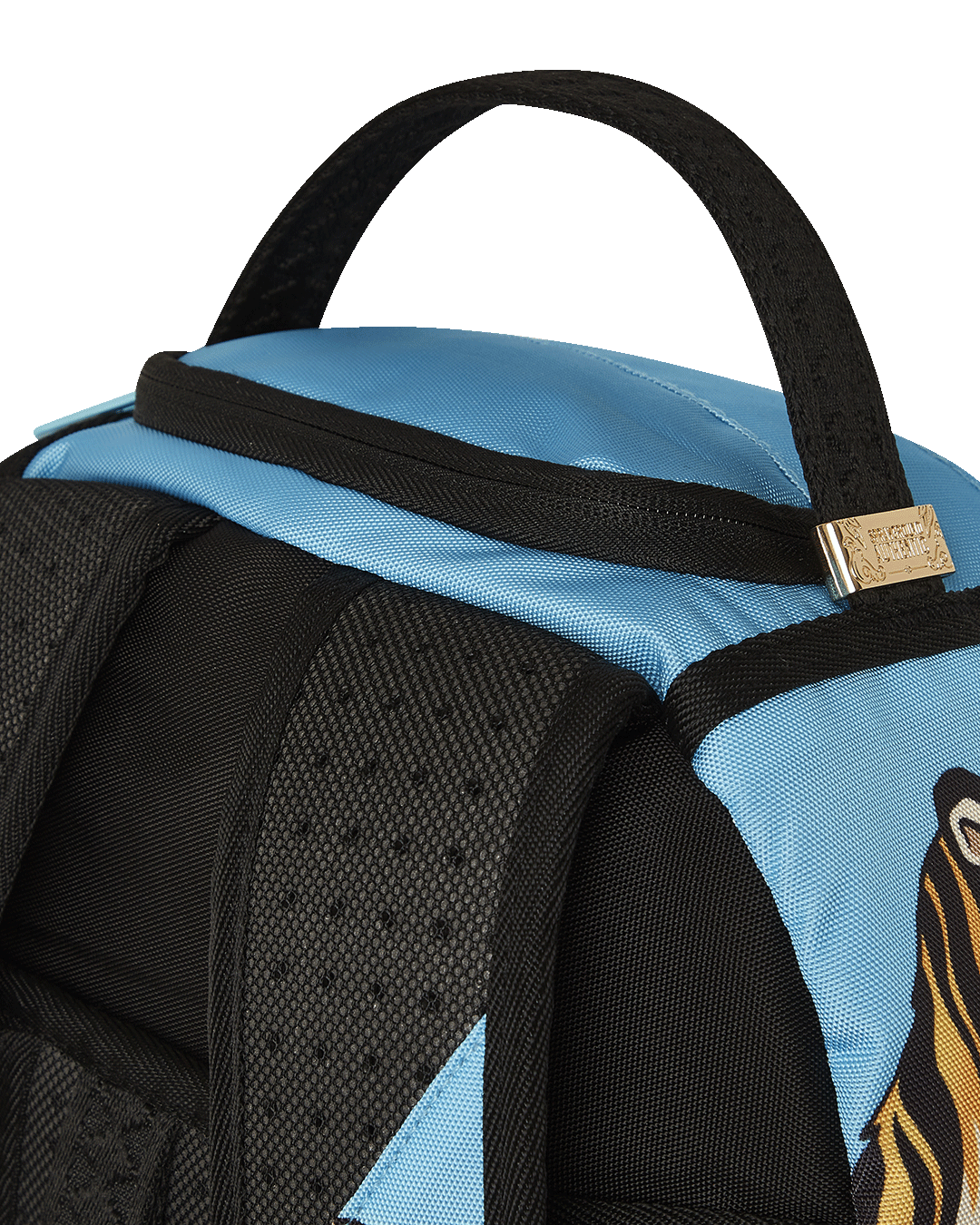 Interior shot of the backpack showing velour laptop compartment and mesh organizer