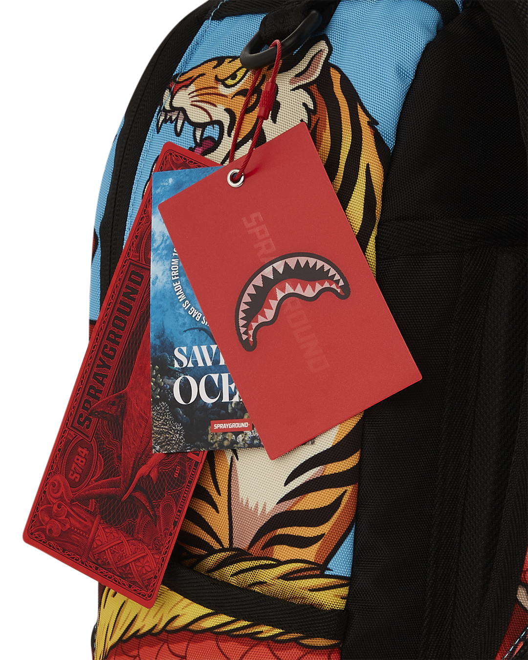 Front view of stylish Sprayground RAP BATTLE DLXSR backpack with gold zippers