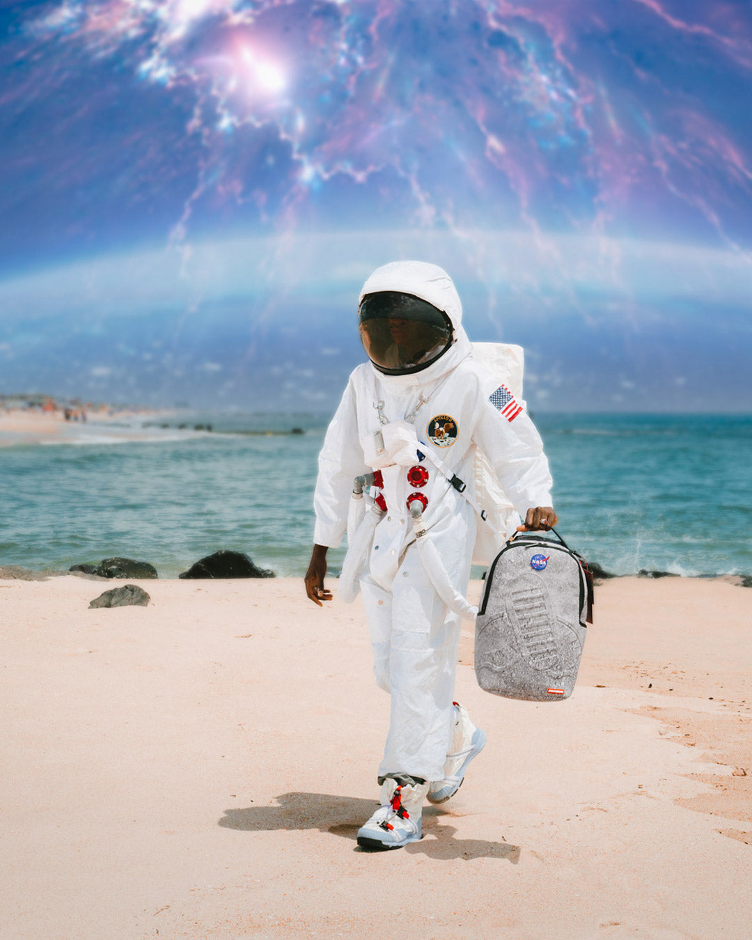 Sprayground NASA backpack with 3D molded design and faux leather material, shown from the front.