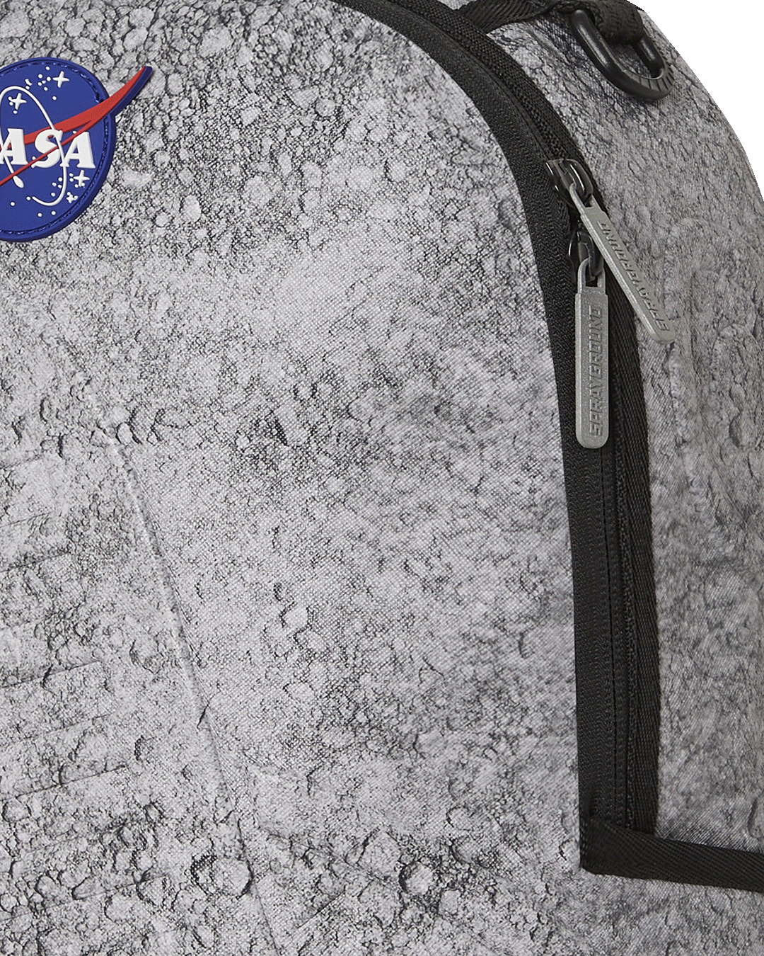 Back view of the Sprayground NASA Moon Shark backpack, highlighting the ergonomic mesh back padding.