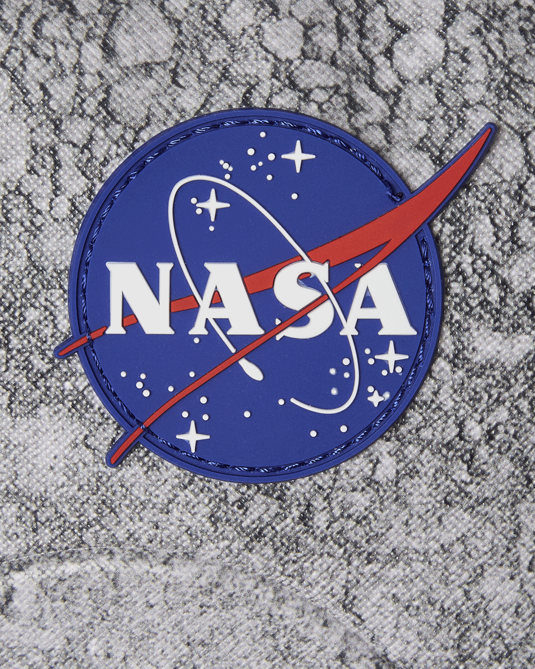Back view of the Sprayground NASA Moon Shark backpack, highlighting the ergonomic mesh back padding.