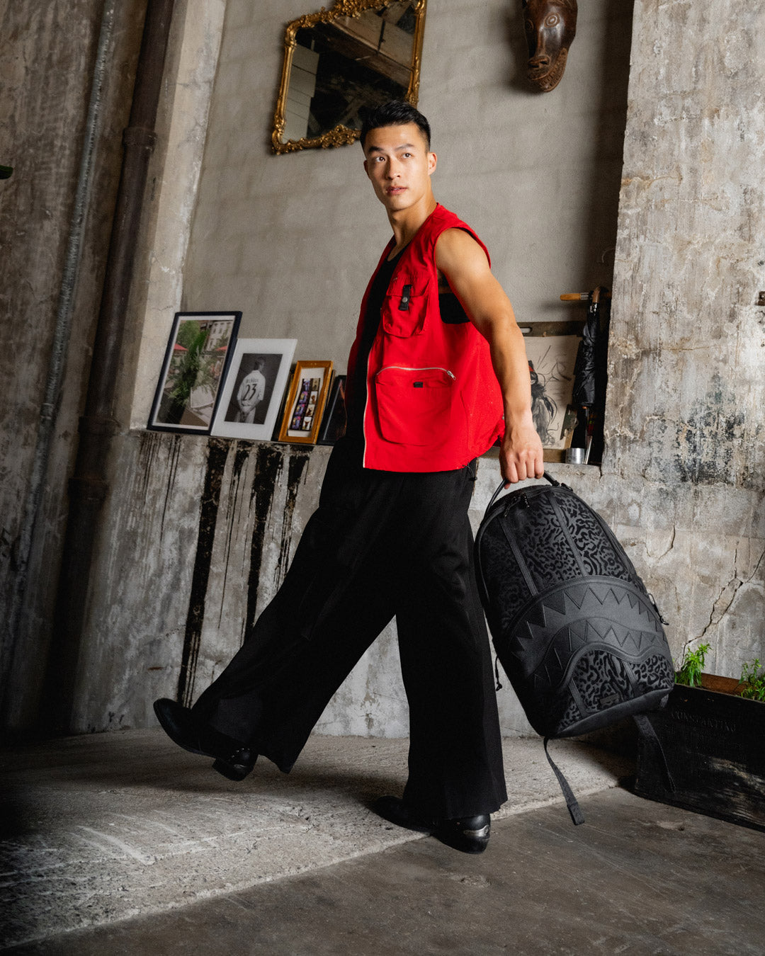 Front view of faux leather backpack with zippered compartments and urban styling