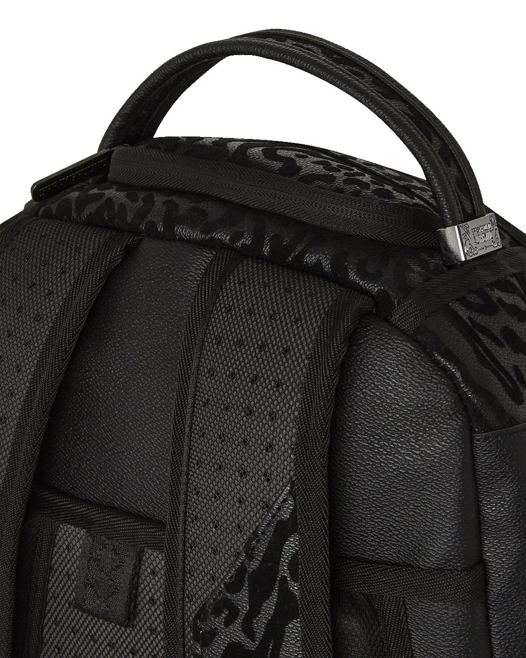 Interior shot showing velour-lined laptop compartment and organized mesh pocket