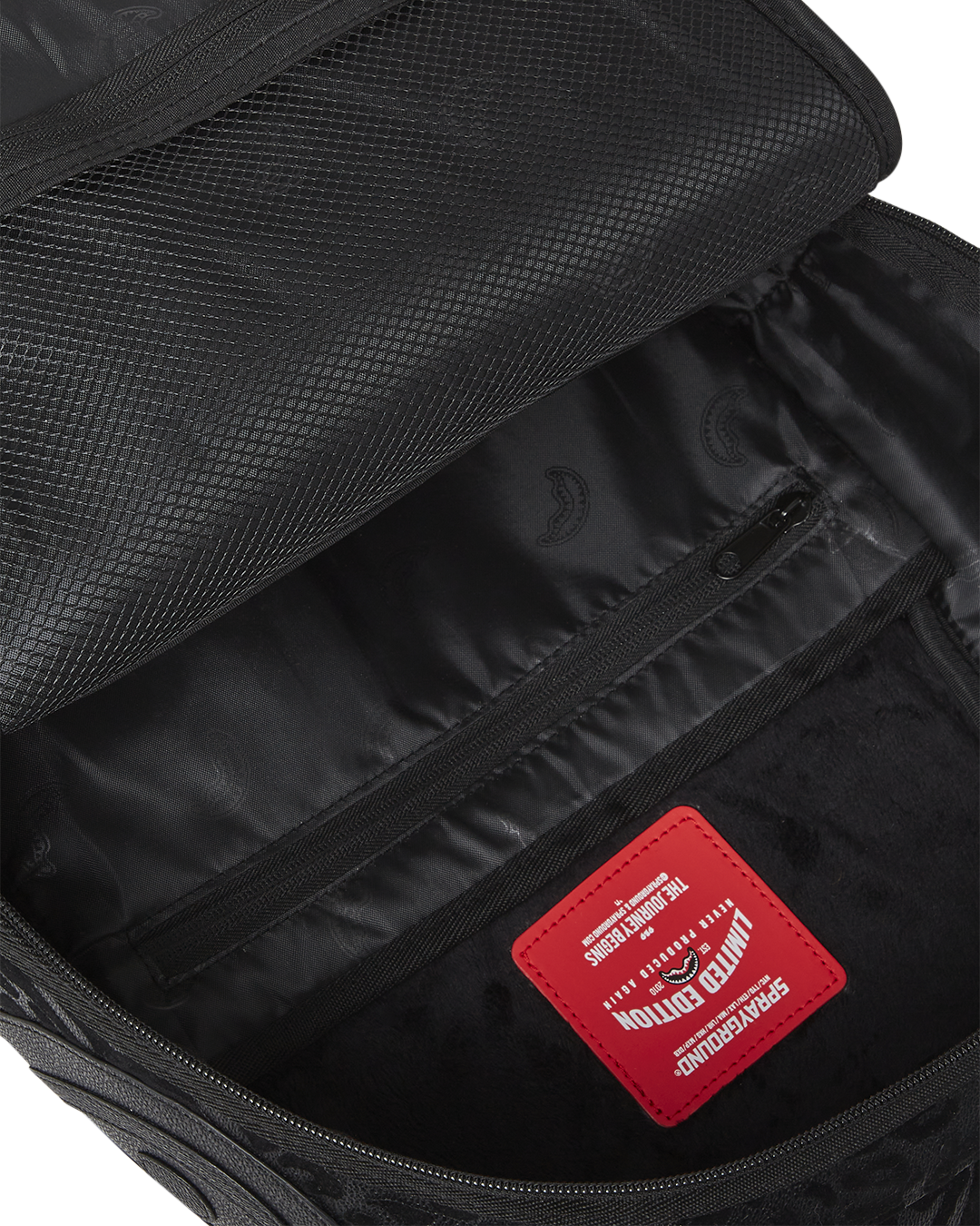 Front view of faux leather backpack with zippered compartments and urban styling