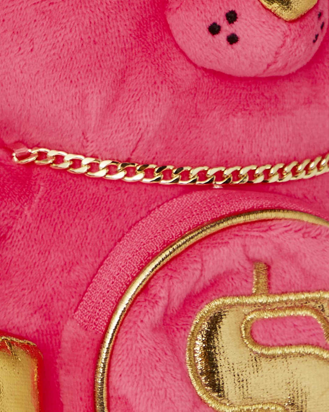 Front view of pink teddy bear backpack with gold embroidery and studs