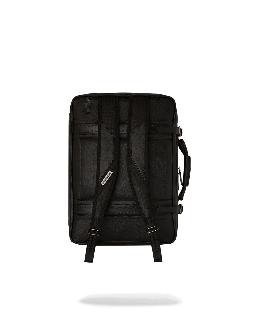 Vintage Leather Carry-On Convertible Backpack in use as a handheld bag