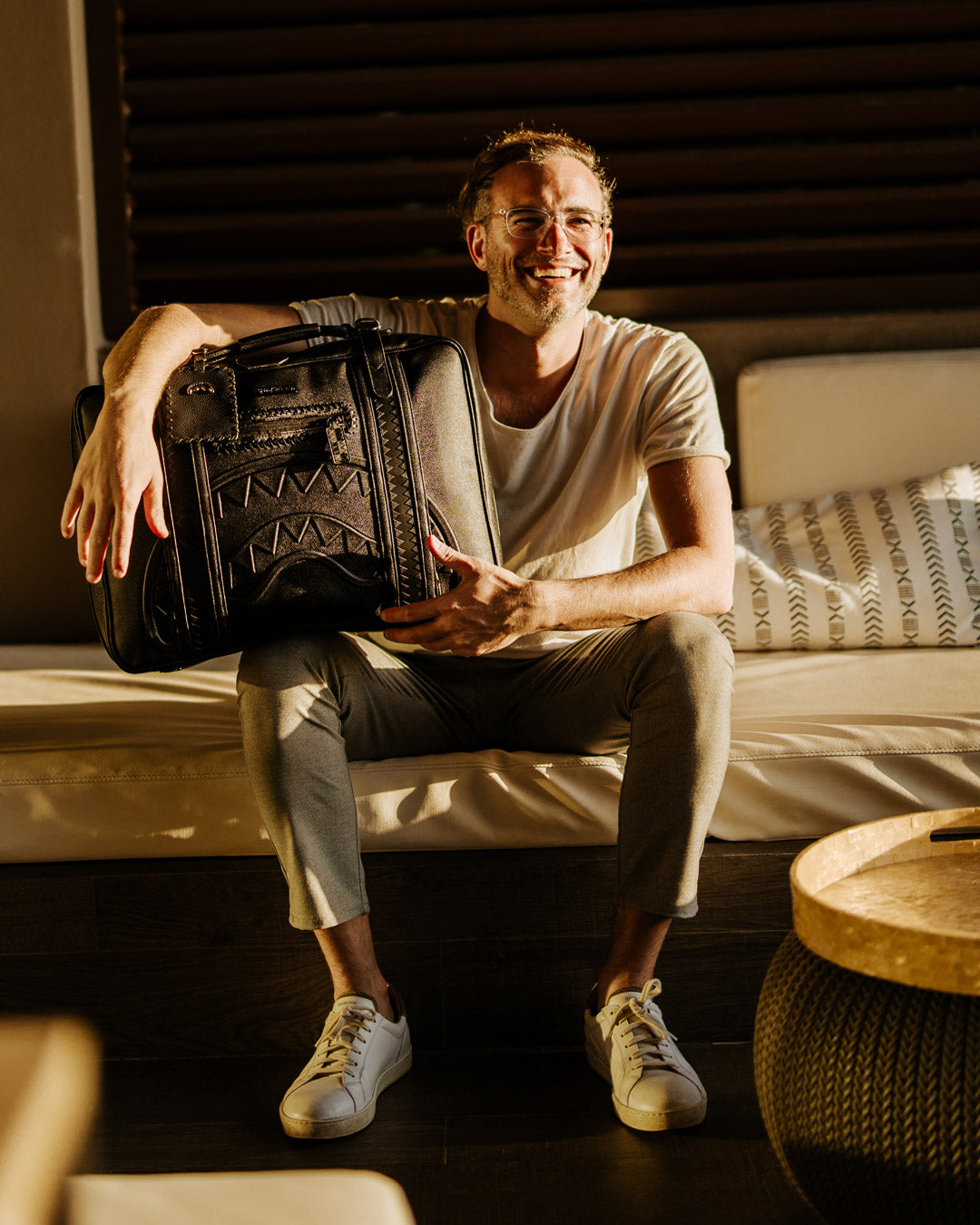 Vintage Leather Carry-On Convertible Backpack in use as a handheld bag