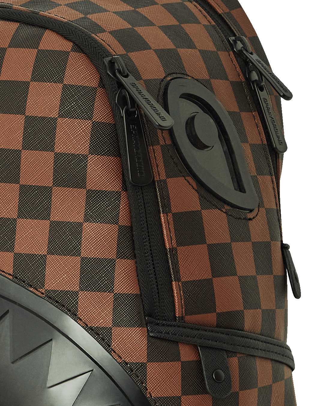Front view of the savage shark mouth faux leather backpack with gold zippers.