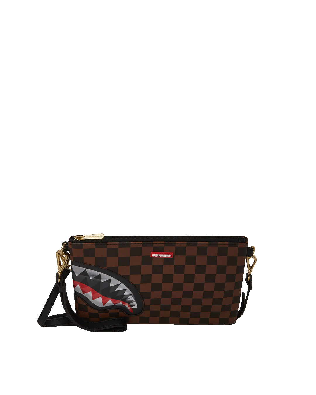 Gold clutch purse with shark mouth design lying flat on marble surface