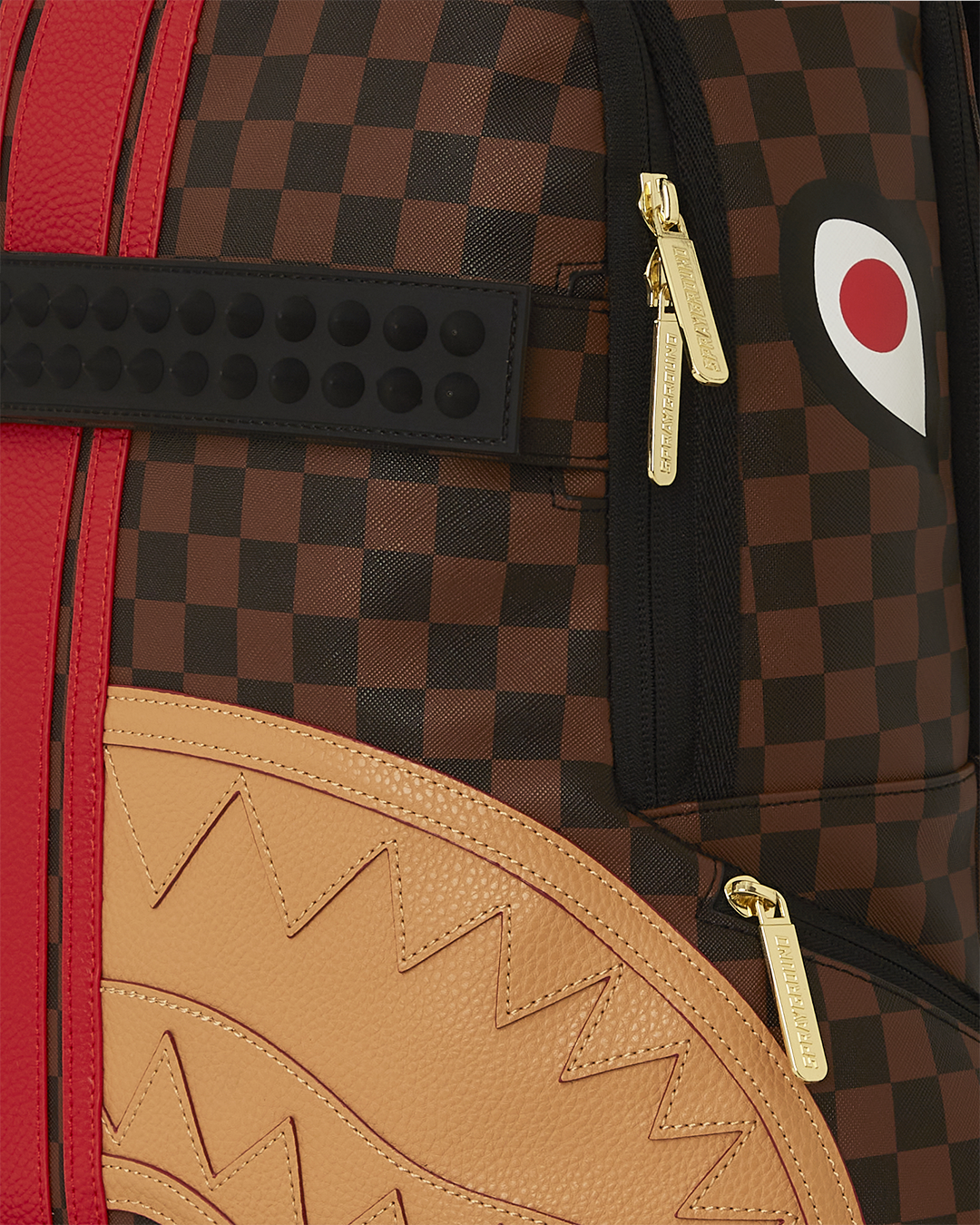 Close-up of adjustable skateboard straps on faux leather backpack.