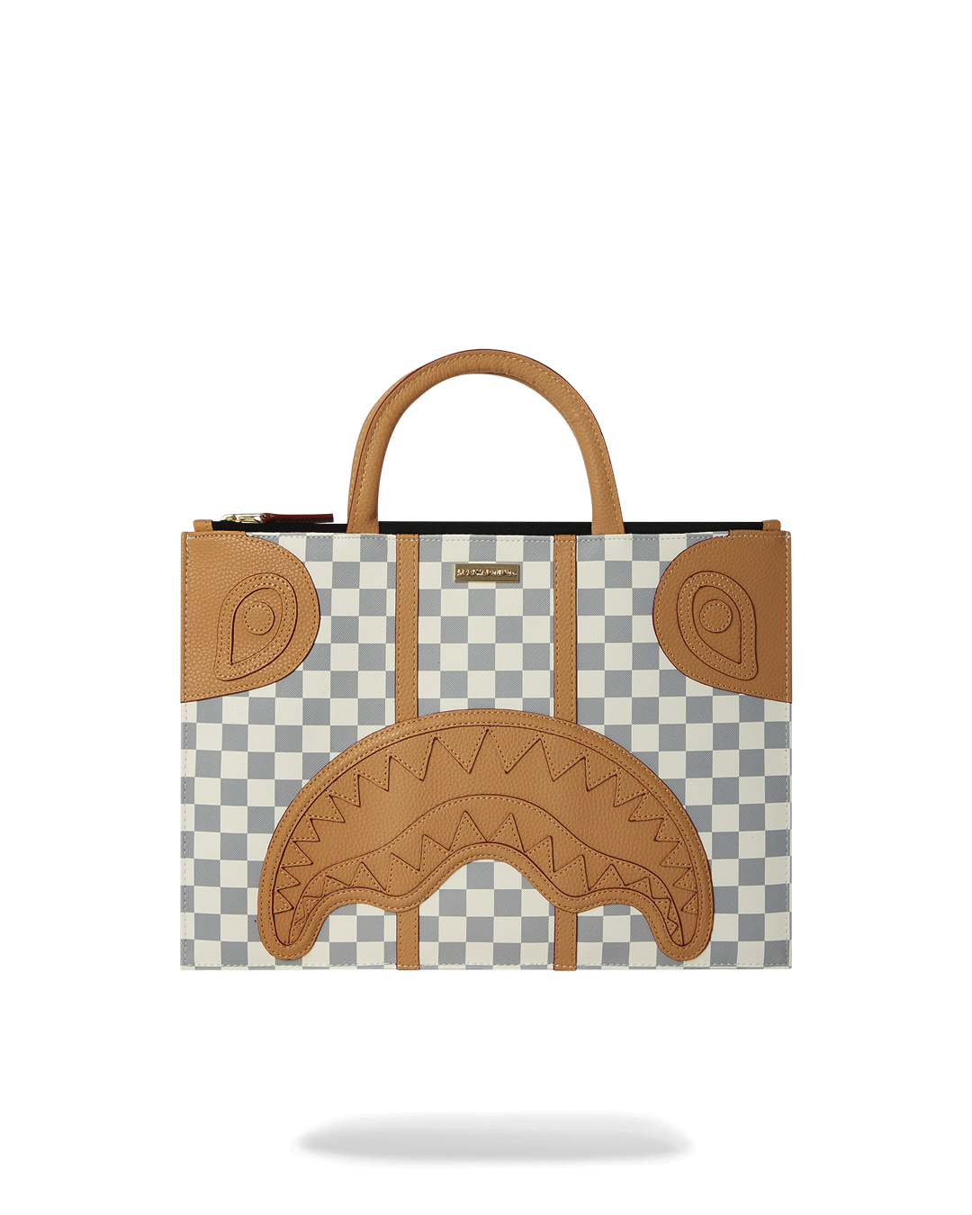 Henny Latte faux leather tote bag worn over the shoulder in a city setting