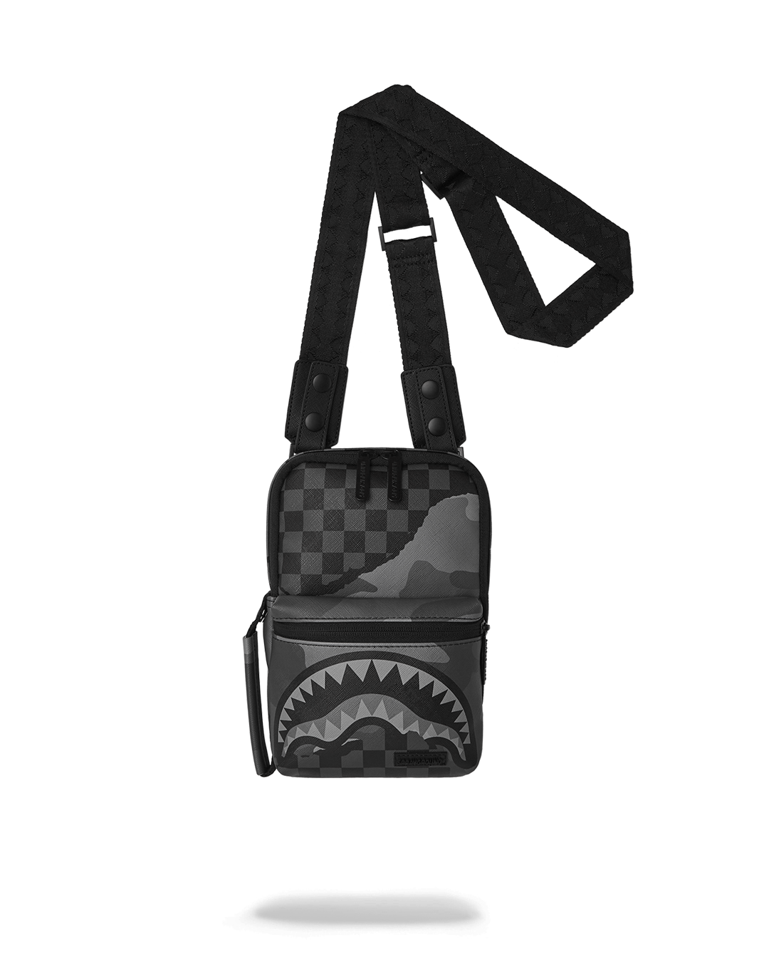 Front angle of the black crossbody bag worn over shoulder sling in a city setting