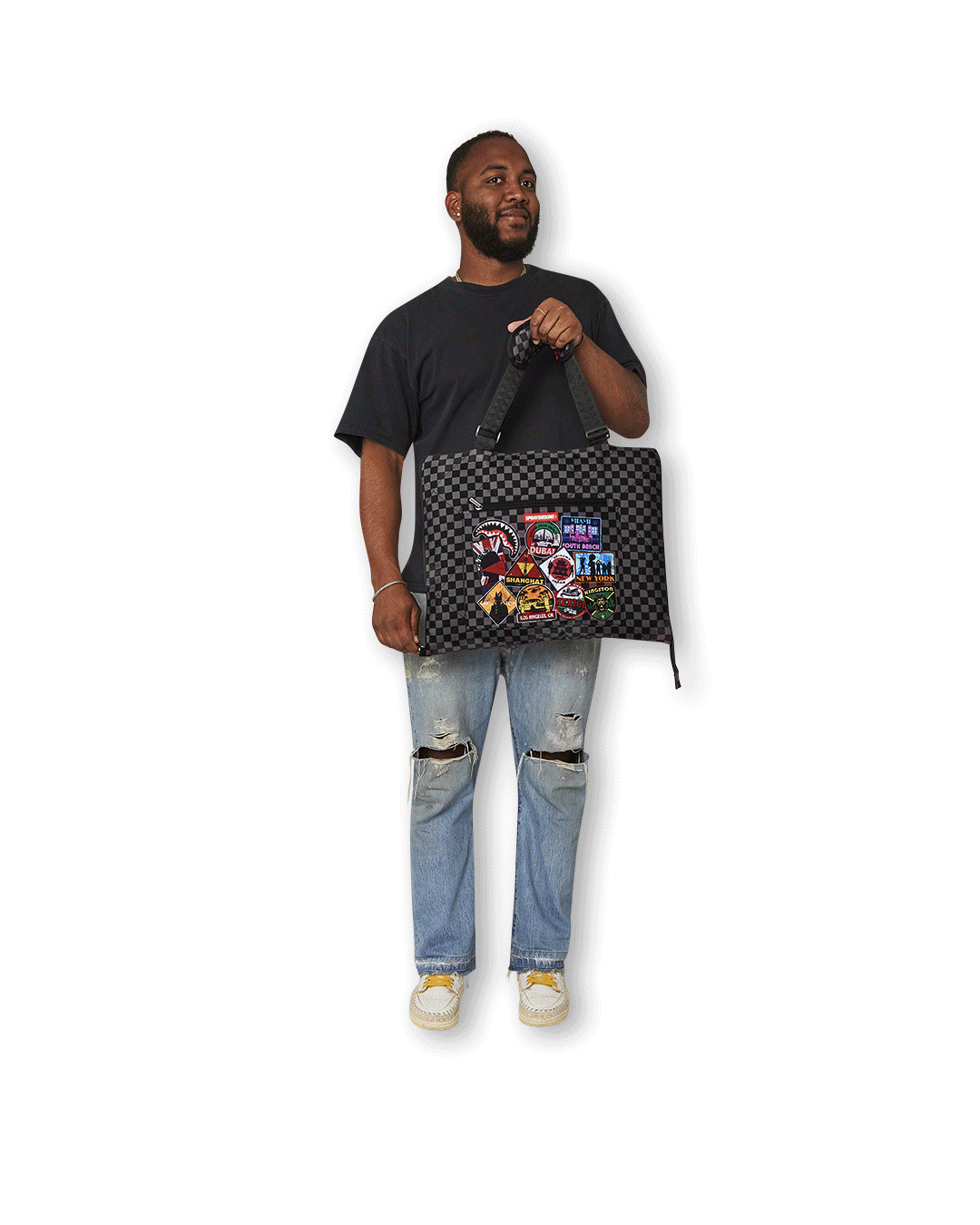 Convertible tote bag in use at the beach with essentials inside