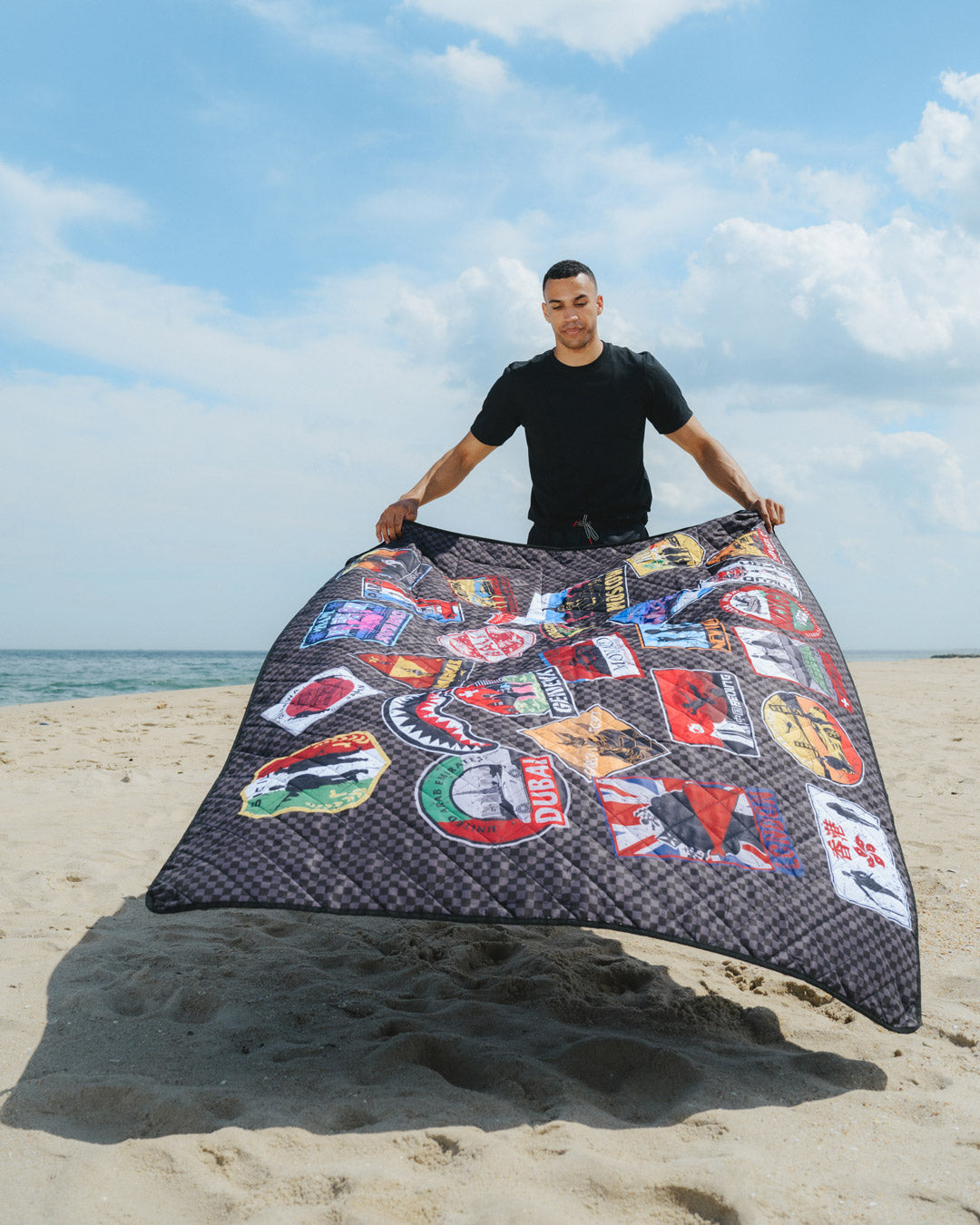 Convertible tote bag in use at the beach with essentials inside