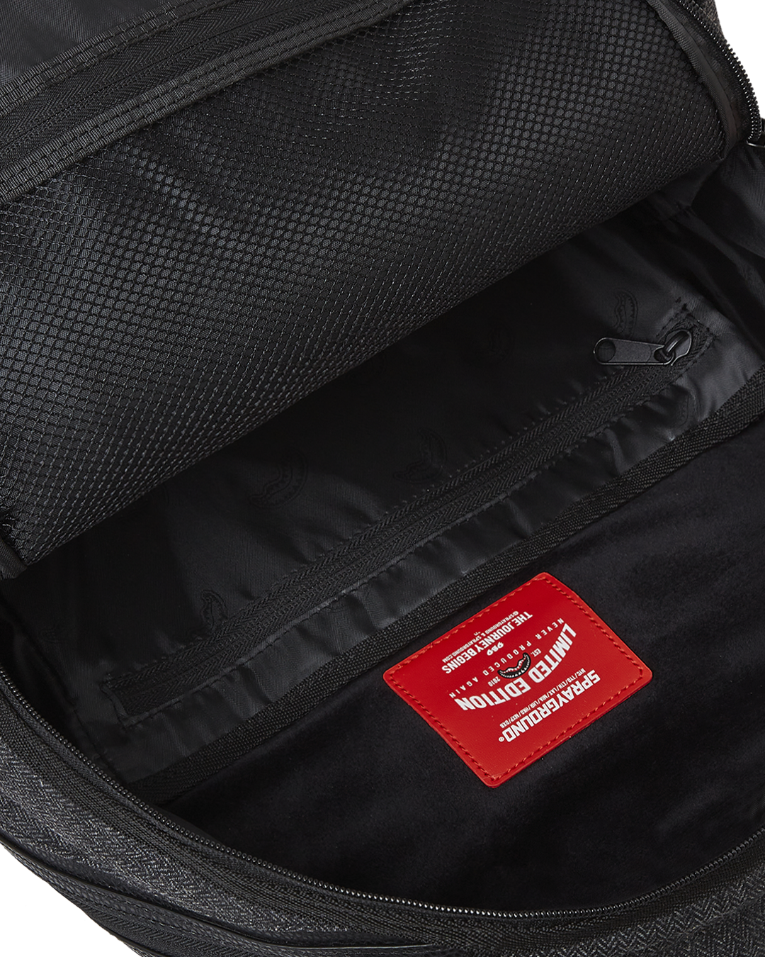 John Wick men’s backpack open, showing interior laptop compartment