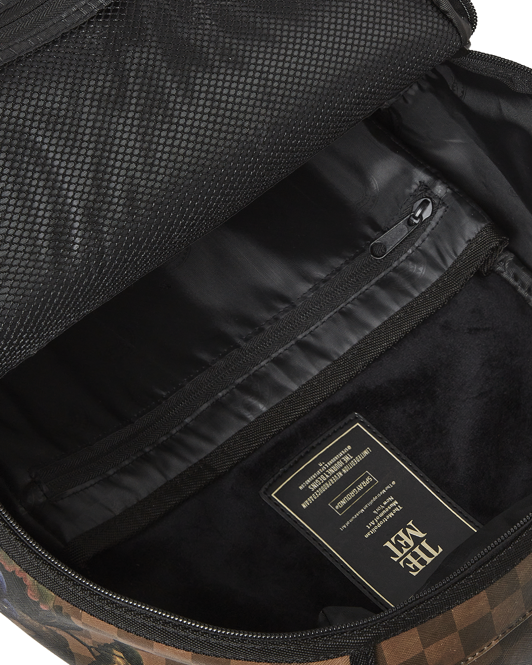 Back view of the backpack, featuring ergonomic mesh padding and adjustable straps.