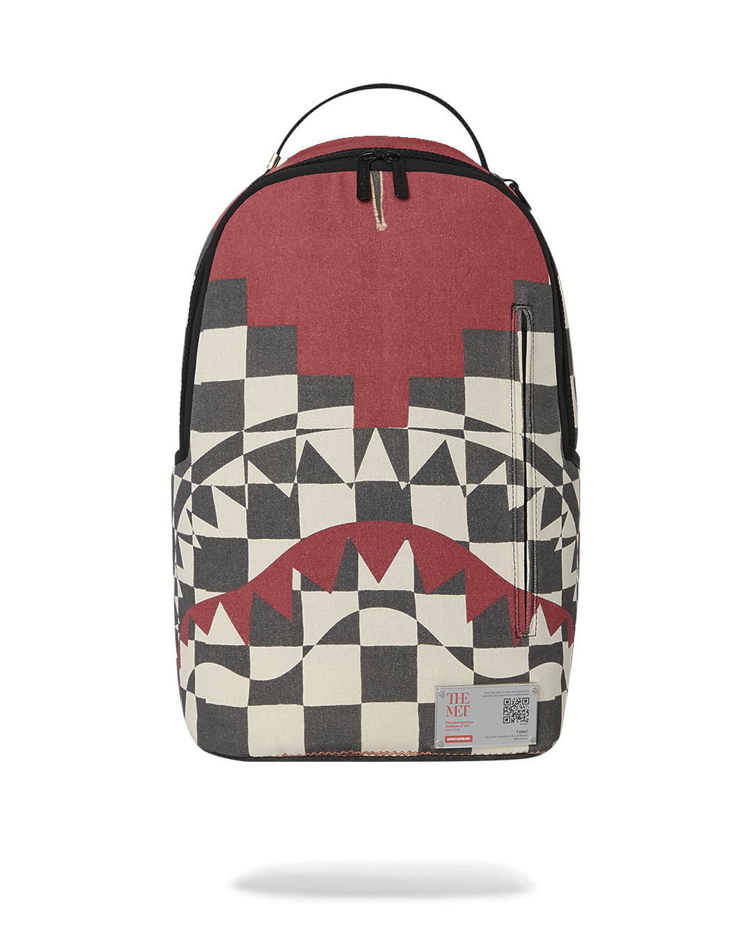 Front view of the Sprayground backpack showcasing the Inca checkerboard pattern and ruby-red details