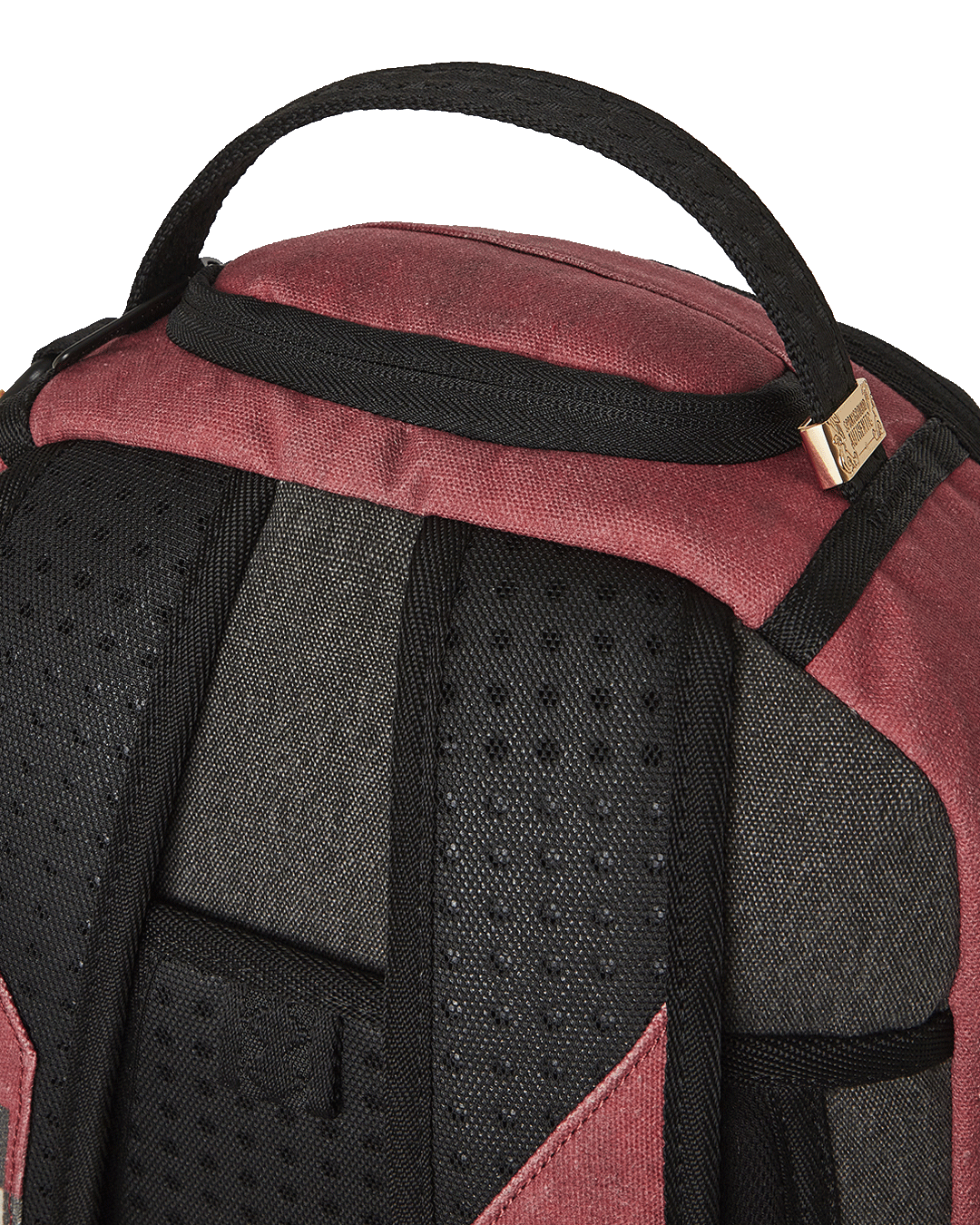 Front view of the Sprayground backpack showcasing the Inca checkerboard pattern and ruby-red details