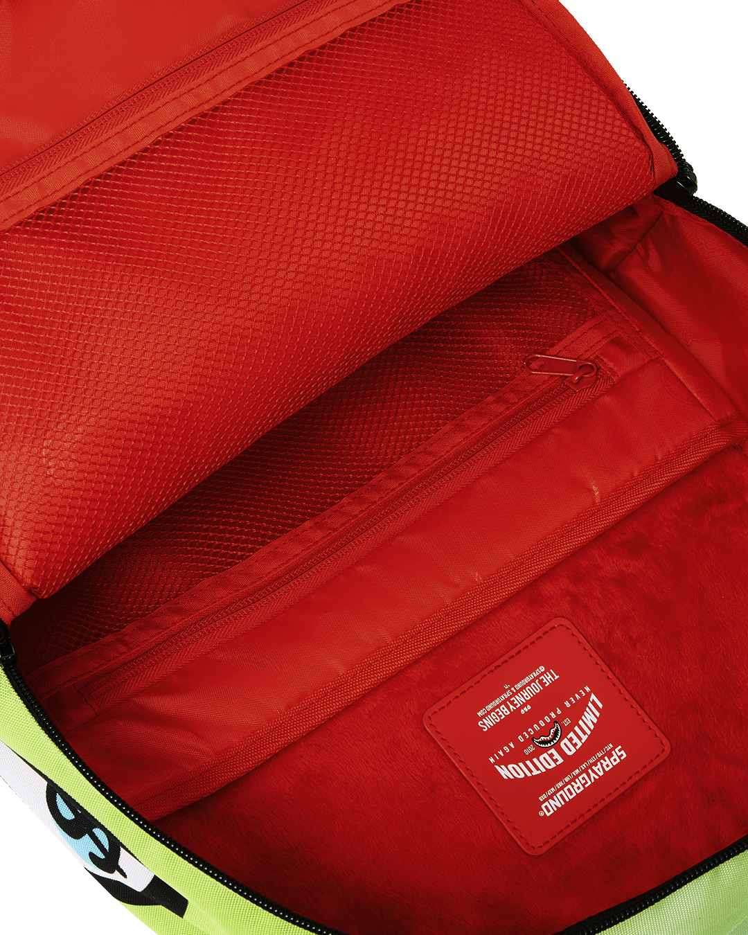 Front view of designer backpack showing gold zippers and front pocket