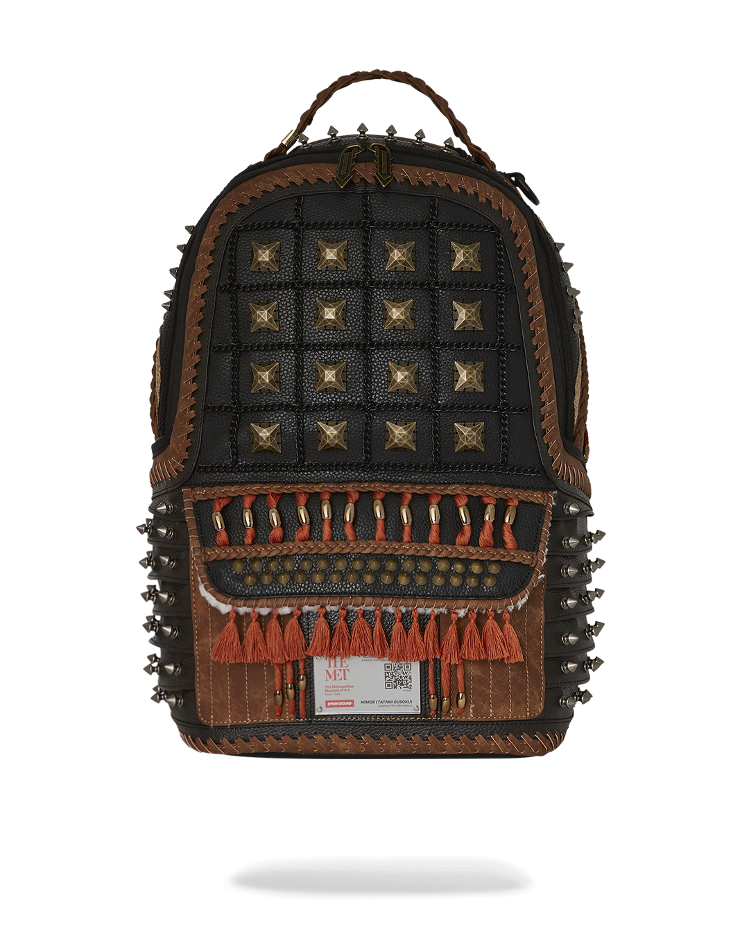 Front view of the faux leather rucksack backpack with gold studs and tassels