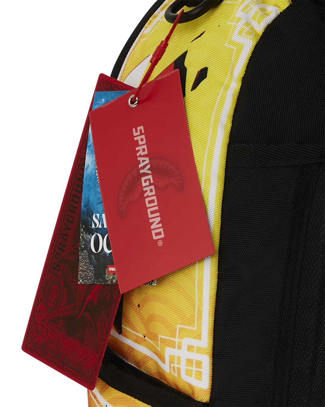 Close-up of Smash DLXRS backpack velour sunglass compartment and metal hardware badge