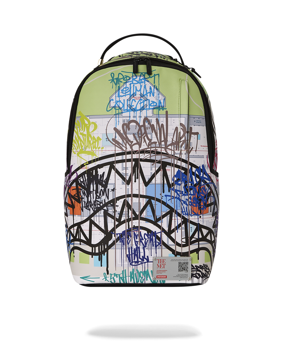 Front view of The Met Map One backpack showcasing graffiti art and shark mouth detail