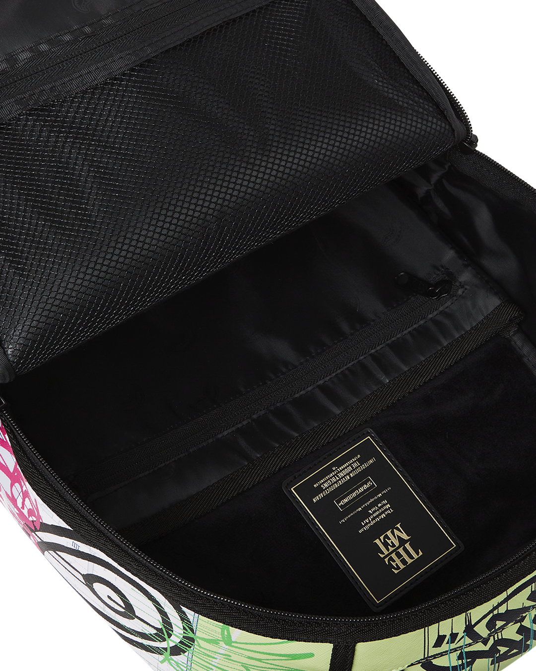 Interior of The Met Map Backpack displaying the velour laptop compartment and organizer.