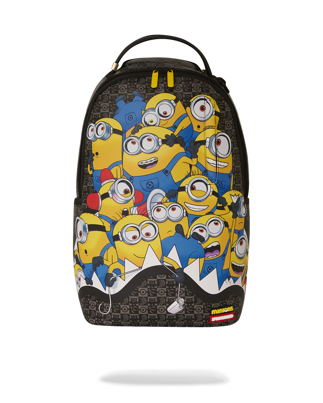 Front angle showing faux leather backpack with Minions print and gold zippers