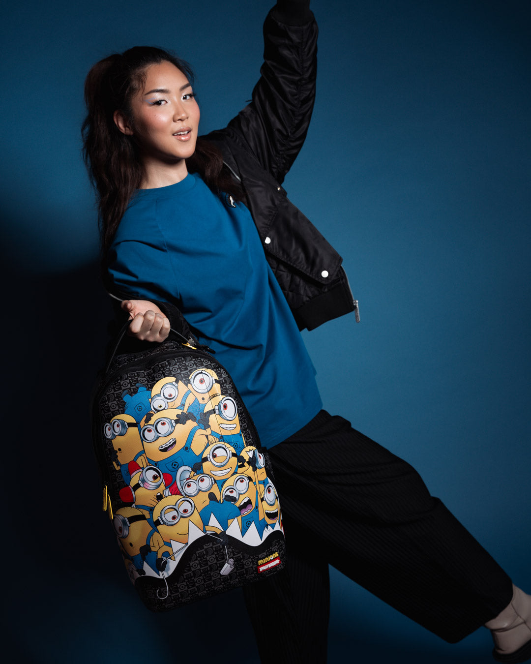 Person wearing the Sprayground crossbody bag style with adjustable straps