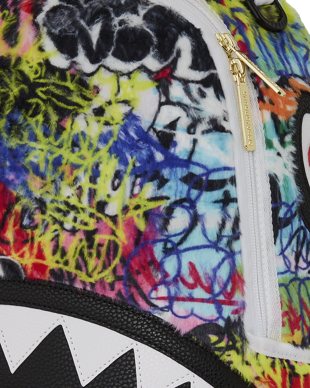 Side pocket of Graffiti Luxe Backpack for quick access to essentials.