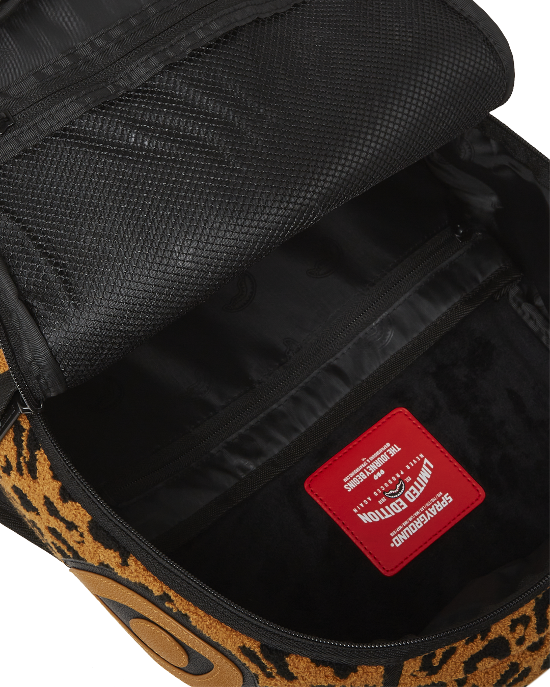 Wild One DLXSF faux leather backpack worn over a shoulder in a city setting