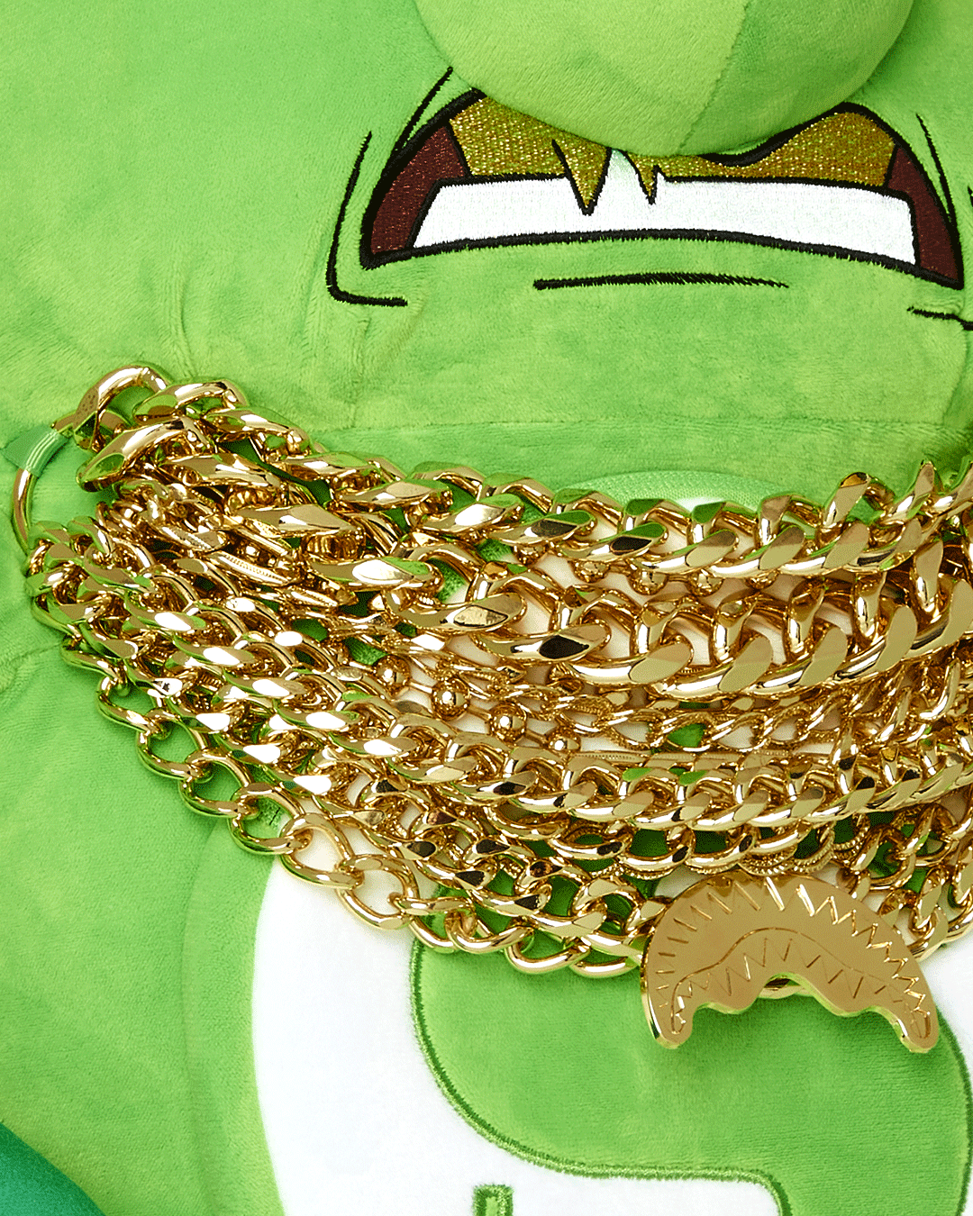Close-up of the teddy bear plush backpack with 12 chains and zippered pockets