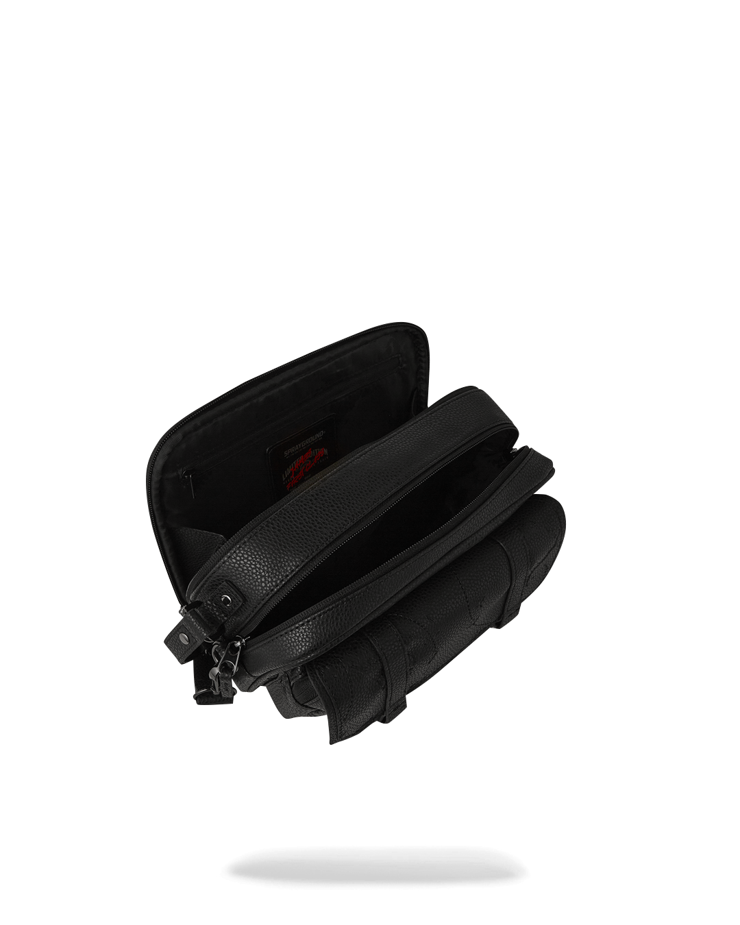 Front view of the Tycoon Traveler black crossbody bag with red zippered pocket