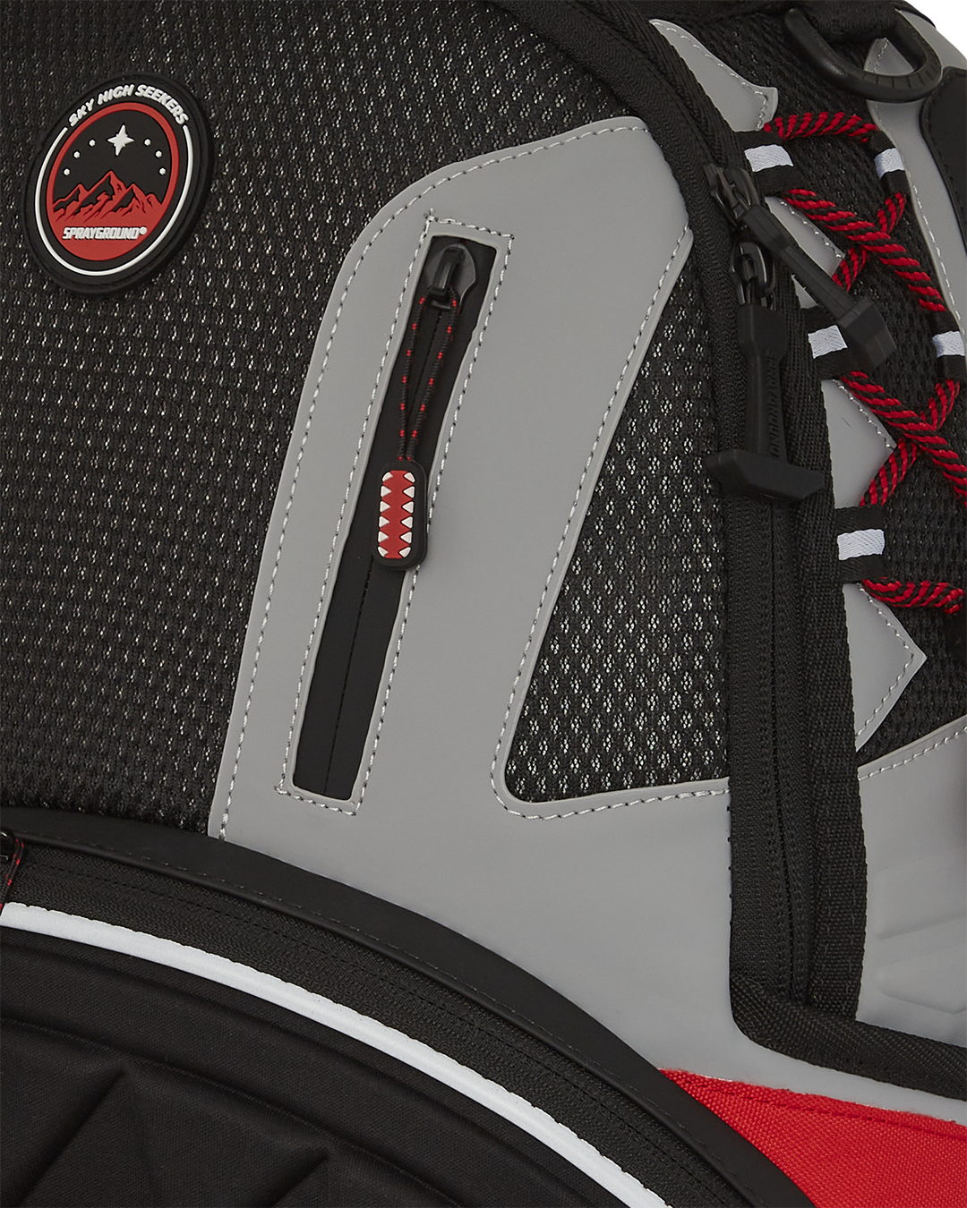 Close-up of water resistant laptop compartment and rubberized PVC details.