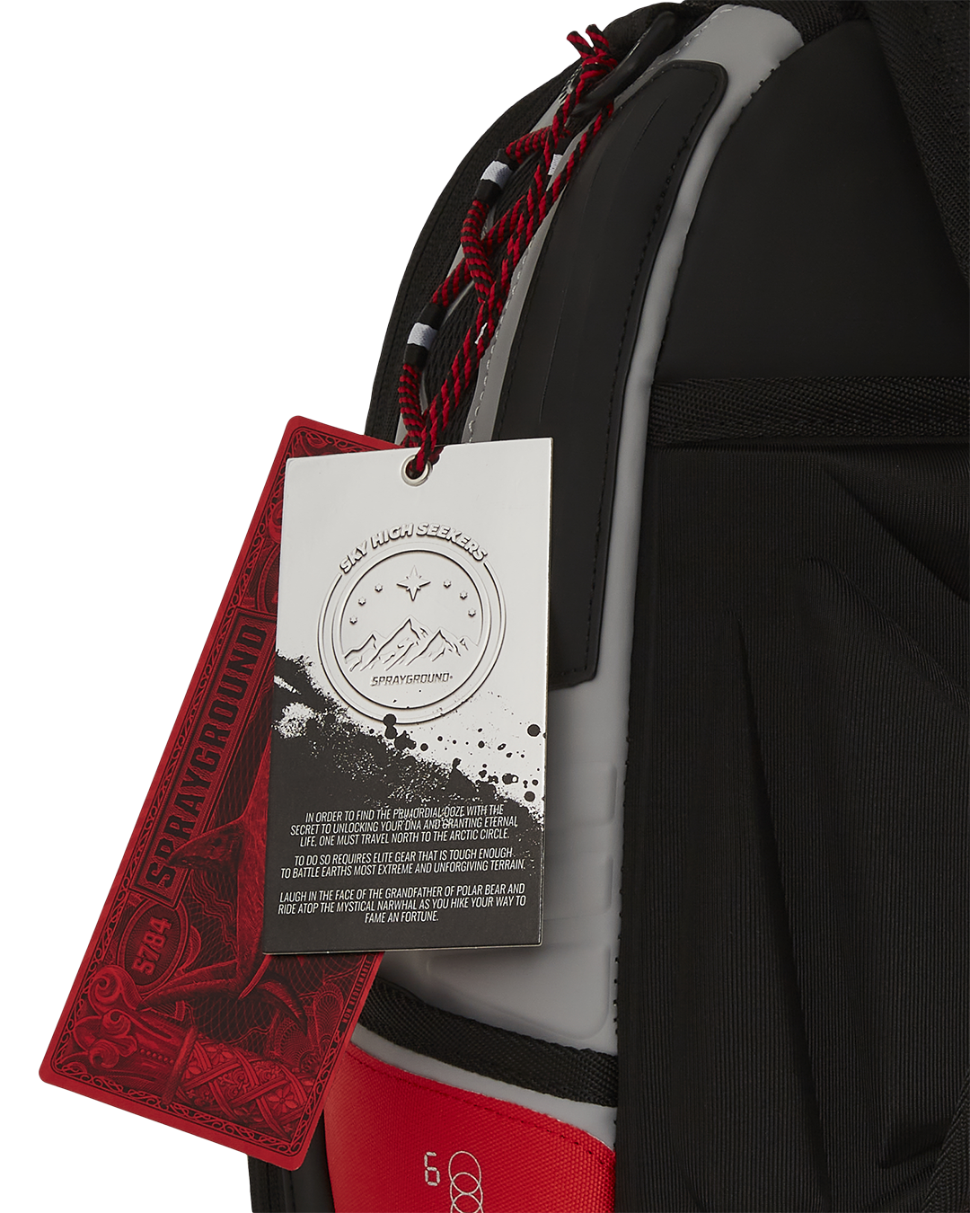 Luxury backpack men’s design showcasing embossed faux leather and red cord handle.