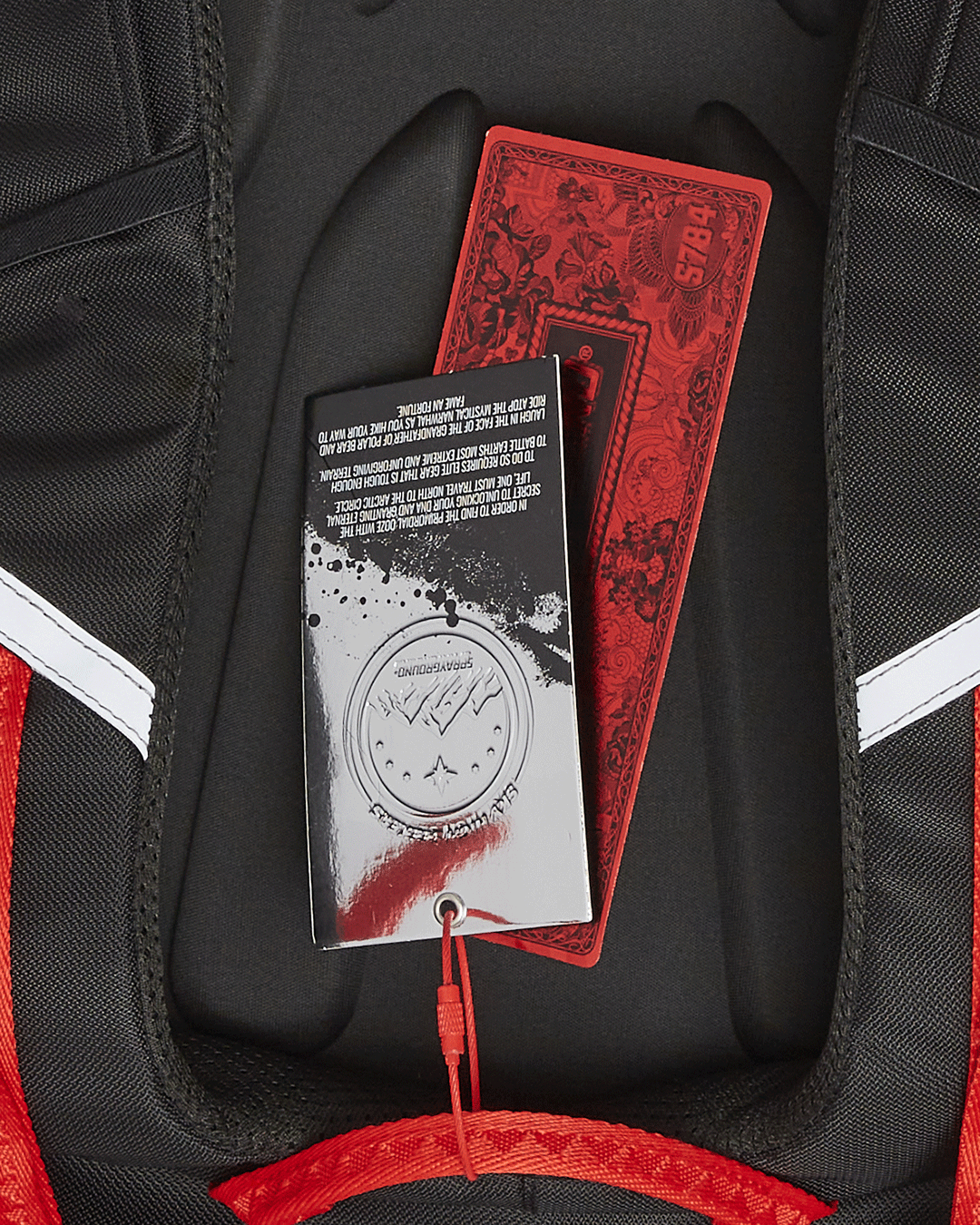 Front view of the Adventure Ready Arctic Trekking Backpack showcasing reflective fabric and pockets.