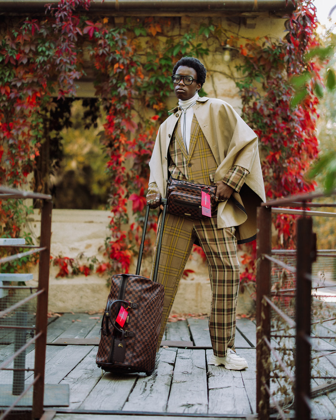 Model wearing the black crossbody bag while traveling.