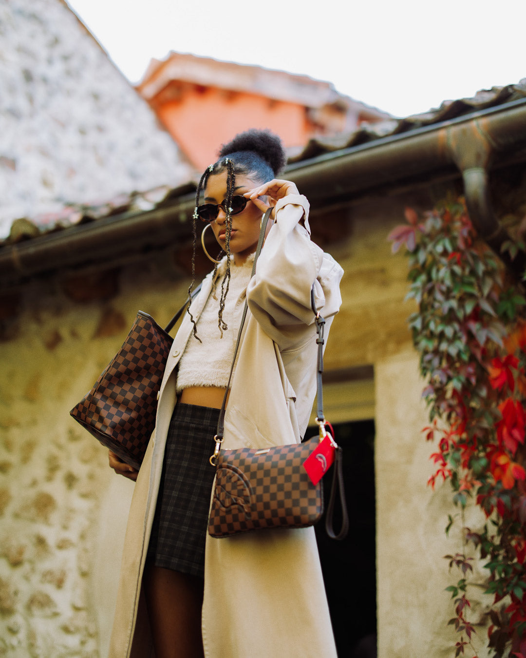 Luxury clutch bag with wristlet strap and gold accents