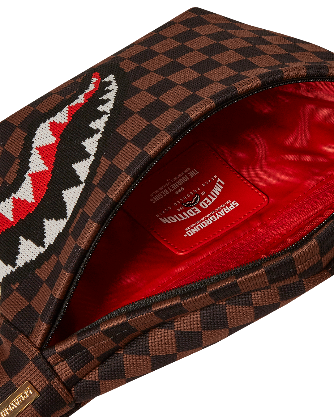 Close-up of Savvy Sharks waist bag showing red zippered pocket and metal hardware