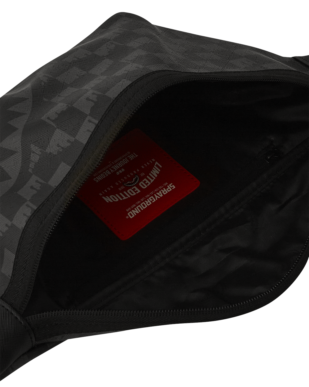 Savvy crossbody waist bag showing adjustable strap and vibrant red zippered pocket.