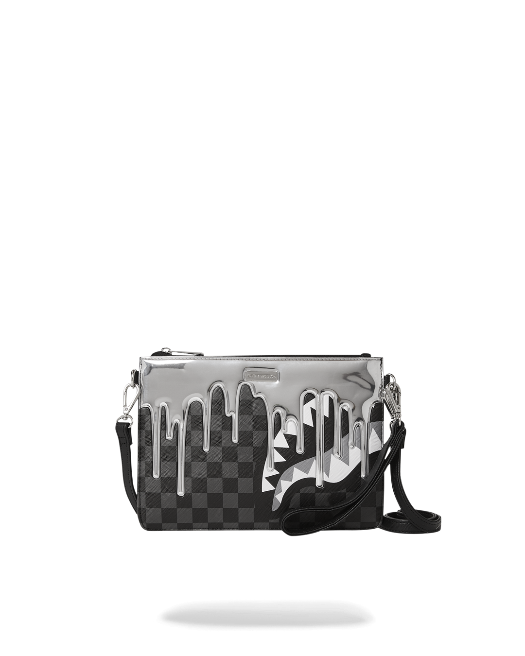 Gold and black Ghost Drip clutch held in hand with strap attached