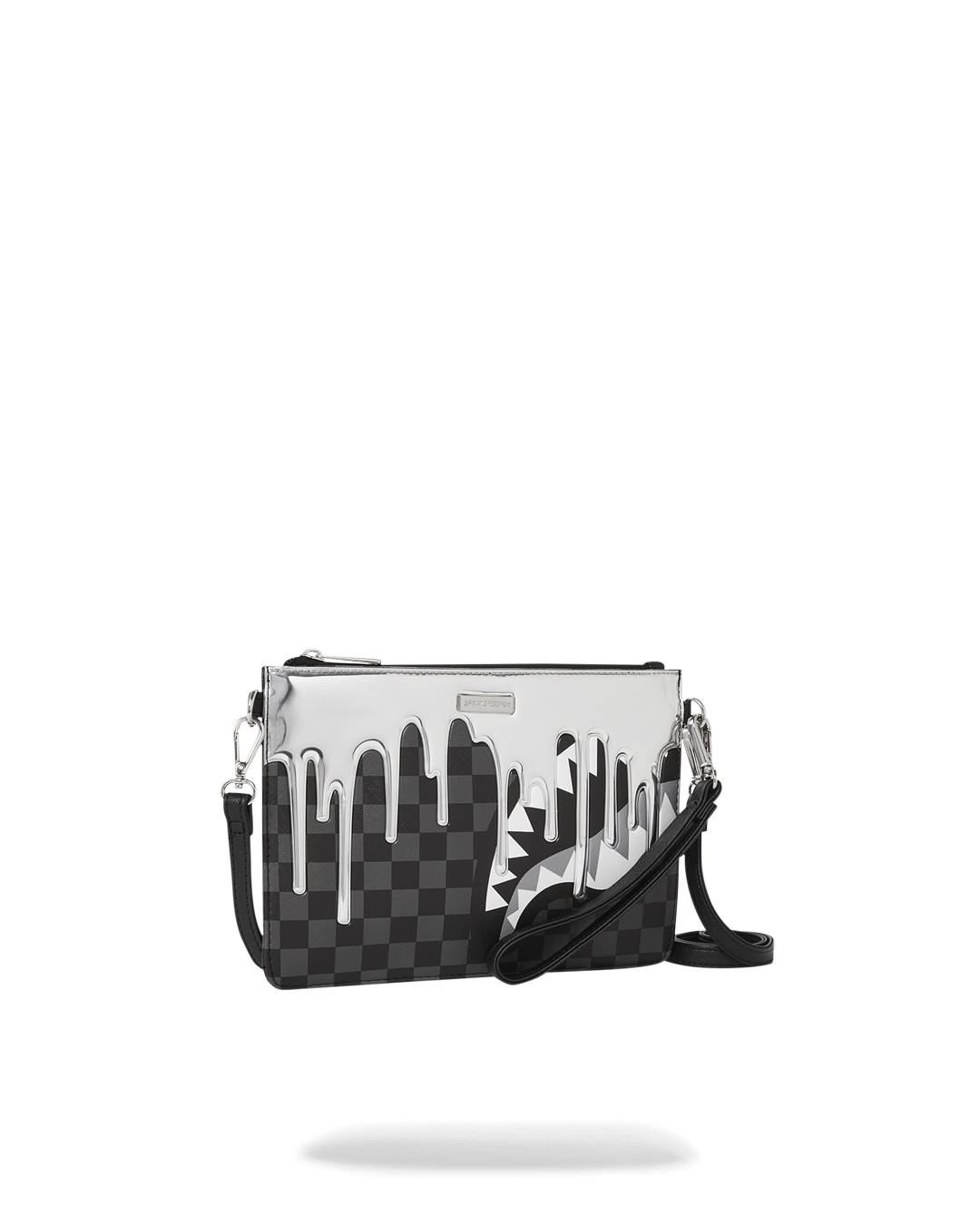 Convertible clutch worn as wristlet with evening outfit