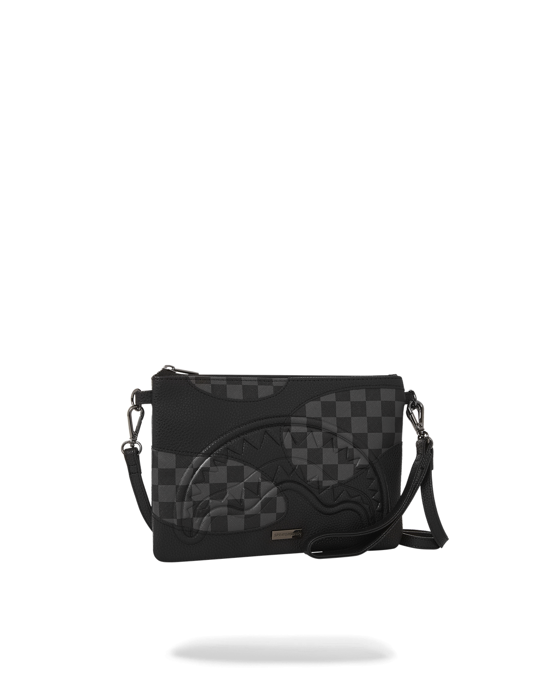 Silver evening bag held as a convertible clutch in a night-out setting