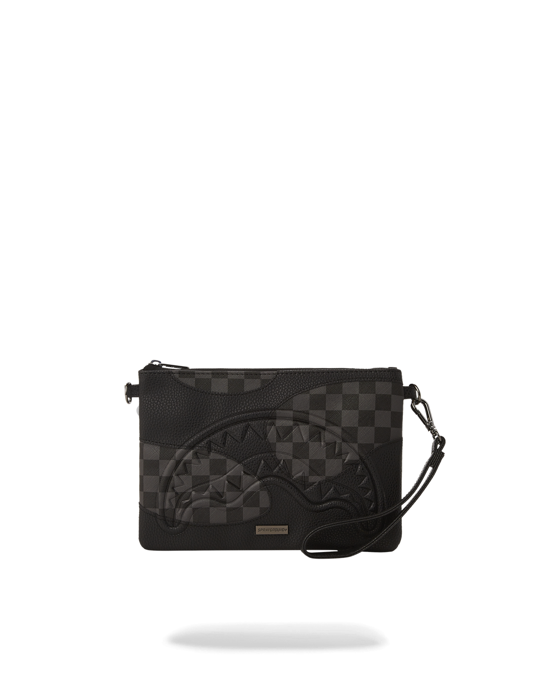 Silver evening bag held as a convertible clutch in a night-out setting